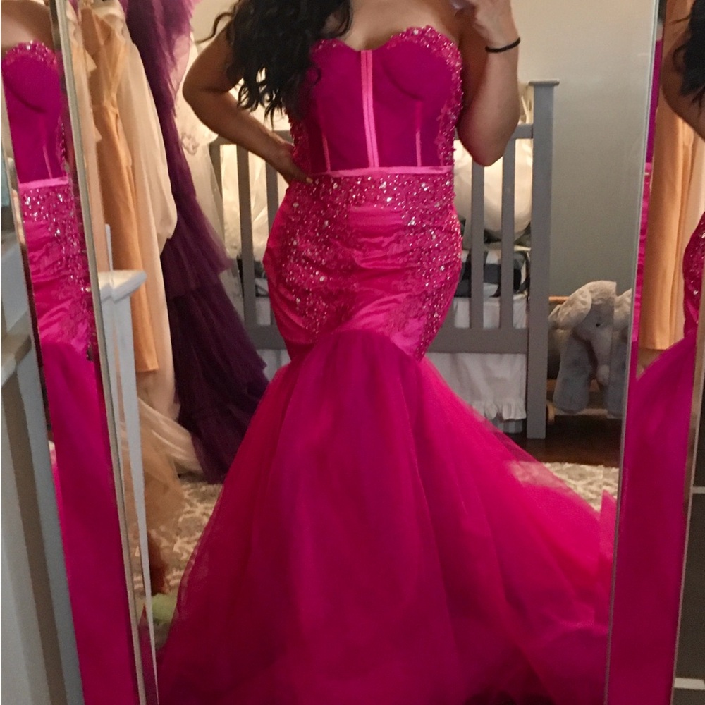 Custom made mermaid silhouette gown. Zipper closure. Magenta colored.